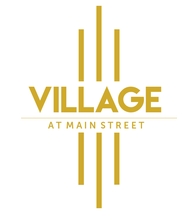 the logo for the village at main street